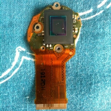 Lumix TZ20 sensor with specks of dust